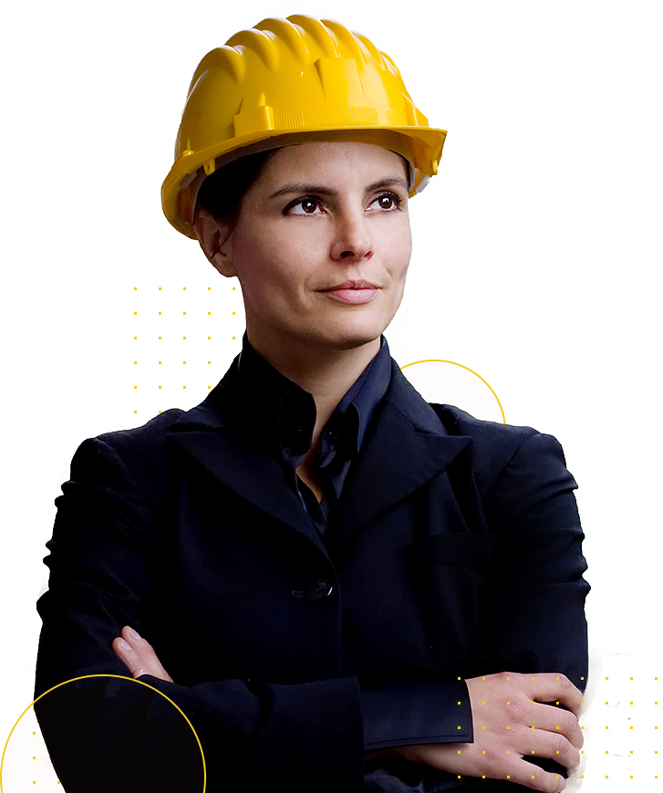 Woman wearing a suit and safety helmet and arms crossed.